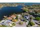 Stunning aerial view of waterfront homes on a sunny day, showcasing beautiful architecture and lush landscaping at 3399 Maple Ne St, St Petersburg, FL 33704