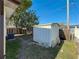 Fenced backyard featuring a shed and green lawn, perfect for outdoor activities and storage at 3501 Beechwood N Ter, Pinellas Park, FL 33781