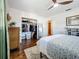 Bright bedroom features hardwood floors, ceiling fan, and a convenient walk-in closet at 3501 Beechwood N Ter, Pinellas Park, FL 33781