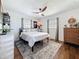 Bright bedroom with a ceiling fan, wood floors, and decor with a rustic, relaxing touch at 3501 Beechwood N Ter, Pinellas Park, FL 33781
