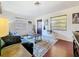 Bright living room with hardwood floors, ample natural light, and comfortable seating at 3501 Beechwood N Ter, Pinellas Park, FL 33781