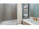 Cozy bathroom with a tub, blue wallpaper, and framed art for a comfortable retreat at 3583 Santa Caterina Blvd, Bradenton, FL 34211