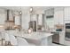 Modern kitchen with stainless steel appliances, a center island, and pendant lighting at 3583 Santa Caterina Blvd, Bradenton, FL 34211