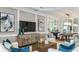 Inviting living room featuring stylish furniture, a decorative console, and adjacent dining area at 3583 Santa Caterina Blvd, Bradenton, FL 34211