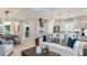 Open-concept living space with kitchen island, dining area, and comfortable seating at 3583 Santa Caterina Blvd, Bradenton, FL 34211