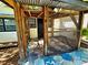 Covered outdoor patio area featuring rustic wooden posts and a stone-tiled floor at 3729 31St S Ave, St Petersburg, FL 33711