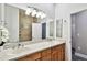 Spacious bathroom with dual sinks, large mirror, and updated fixtures, offering a functional and stylish design at 3844 Wellington Pkwy, Palm Harbor, FL 34685
