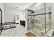 Large bathroom showcases a spacious walk-in shower, dual vanities, and stylish tile work for a modern aesthetic at 3844 Wellington Pkwy, Palm Harbor, FL 34685