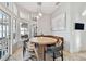 Bright dining area boasts natural light from large windows and a cozy built-in booth at 3844 Wellington Pkwy, Palm Harbor, FL 34685