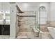 Stylish walk-in shower boasts glass enclosure, bench seating and dual shower heads, for spa-like showering at 3844 Wellington Pkwy, Palm Harbor, FL 34685