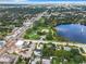 Aerial view showcasing lakefront property with a park, fountain and city skyline at 405 S Lake Dr, Clearwater, FL 33755