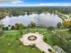 Aerial view showcases lakefront property with a park, fountain and city skyline at 405 S Lake Dr, Clearwater, FL 33755