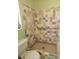 Bathroom featuring colorful mosaic tile shower and grab bar at 405 S Lake Dr, Clearwater, FL 33755