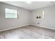 Bedroom with wood-look flooring and natural light at 405 S Lake Dr, Clearwater, FL 33755