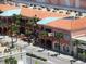 An aerial view of a commercial area featuring shops, restaurants, and well-maintained streets at 405 S Lake Dr, Clearwater, FL 33755