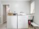 Dedicated laundry room with appliances and ample counter space at 405 S Lake Dr, Clearwater, FL 33755