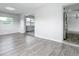 Bright living room with wood-look flooring and natural light, offering an inviting atmosphere at 405 S Lake Dr, Clearwater, FL 33755