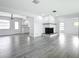Spacious living room featuring sleek, modern flooring and an open concept design at 405 S Lake Dr, Clearwater, FL 33755