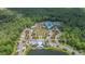 An aerial view captures the community clubhouse, pools, and green spaces at 4195 Welling Ter, Land O Lakes, FL 34638