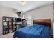 Bedroom featuring a desk, shelves, and a bed with a blue comforter at 4195 Welling Ter, Land O Lakes, FL 34638