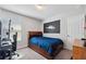Bedroom with a desk and ample natural light at 4195 Welling Ter, Land O Lakes, FL 34638