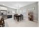 Spacious dining area with dark wooden table, stainless refrigerator, and bright natural light at 4195 Welling Ter, Land O Lakes, FL 34638