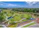 Aerial view of a community dog park with walking paths, play areas, and landscaping at 4195 Welling Ter, Land O Lakes, FL 34638