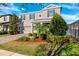 Charming two-story home with manicured lawn, brick driveway, and lush landscaping at 4195 Welling Ter, Land O Lakes, FL 34638