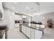 Open kitchen with stainless steel appliances, large island, and adjacent dining area at 4195 Welling Ter, Land O Lakes, FL 34638
