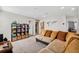 Upstairs den with plush couches, shelving, and carpeted flooring at 4195 Welling Ter, Land O Lakes, FL 34638
