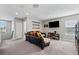 Upstairs den with plush couches, a wall-mounted TV, and carpeted flooring at 4195 Welling Ter, Land O Lakes, FL 34638