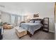 Carpeted primary bedroom with natural light from windows and an ensuite bathroom at 4195 Welling Ter, Land O Lakes, FL 34638