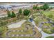 Aerial view of a pump park with winding trails, trees, and park benches at 4195 Welling Ter, Land O Lakes, FL 34638