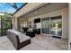 Outdoor patio with comfortable furniture, grill and mounted tv, great for entertaining at 4195 Welling Ter, Land O Lakes, FL 34638