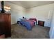 Bedroom featuring carpet and a bed with an American themed blanket at 4210 Pacente Loop, Zephyrhills, FL 33543