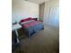 Bedroom featuring carpet and a bed with a large window and white walls at 4210 Pacente Loop, Zephyrhills, FL 33543