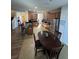 Open concept kitchen with stainless steel appliances and ample cabinet space at 4210 Pacente Loop, Zephyrhills, FL 33543