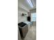 Laundry room with side-by-side washer and dryer and shelving at 4210 Pacente Loop, Zephyrhills, FL 33543