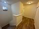 Stairwell featuring wood-look flooring at 4210 Pacente Loop, Zephyrhills, FL 33543