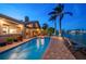 Home exterior featuring a lovely pool, spa, and a private waterfront view at 447 22Nd St, Belleair Beach, FL 33786