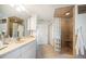 Bathroom with shower, single vanity, and linen closet at 447 22Nd St, Belleair Beach, FL 33786