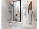 Bathroom featuring a glass-enclosed shower and modern fixtures at 447 22Nd St, Belleair Beach, FL 33786