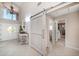 Spacious foyer with a sliding barn door, chandelier, and high ceilings at 447 22Nd St, Belleair Beach, FL 33786