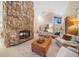Inviting living room with a stone fireplace, neutral decor, and an open layout at 447 22Nd St, Belleair Beach, FL 33786