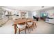Open-concept layout featuring a dining area that leads into the kitchen and living room at 447 22Nd St, Belleair Beach, FL 33786