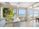 Bright office space with expansive windows, tile floor, and water view at 447 22Nd St, Belleair Beach, FL 33786