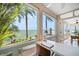 Bright office space with expansive windows, tile floor, and water view at 447 22Nd St, Belleair Beach, FL 33786