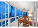 Bright office space with expansive windows, tile floor, and water view at 447 22Nd St, Belleair Beach, FL 33786