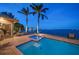 Exterior view of a pool and spa area on a waterfront property at 447 22Nd St, Belleair Beach, FL 33786