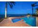 Sparkling pool and patio area with serene bay views at 447 22Nd St, Belleair Beach, FL 33786